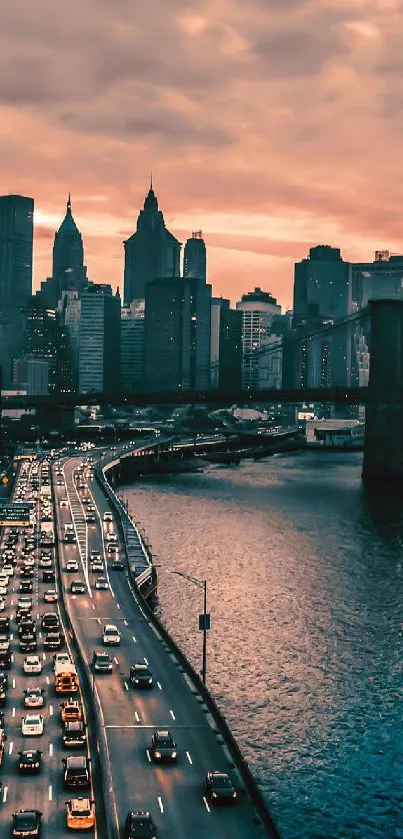 New York City skyline at sunset with glowing sky and Brooklyn Bridge view.