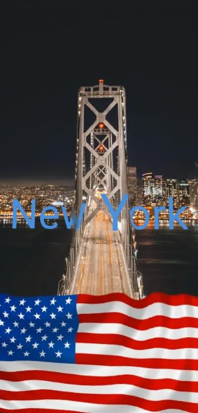 New York bridge at night with cityscape and American flag.