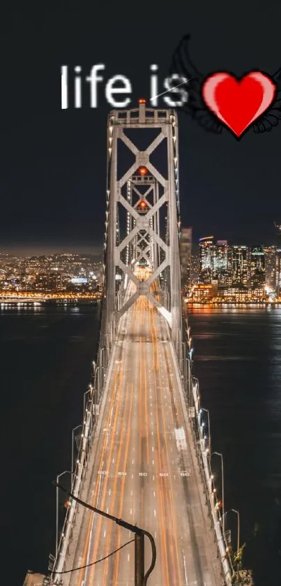 Lit bridge over water with heart design at night.