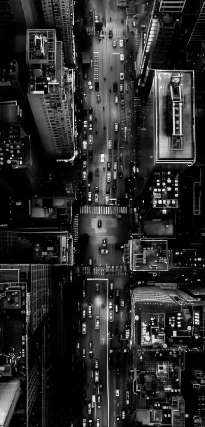 Aerial view of a vibrant city at night with illuminated streets and buildings.