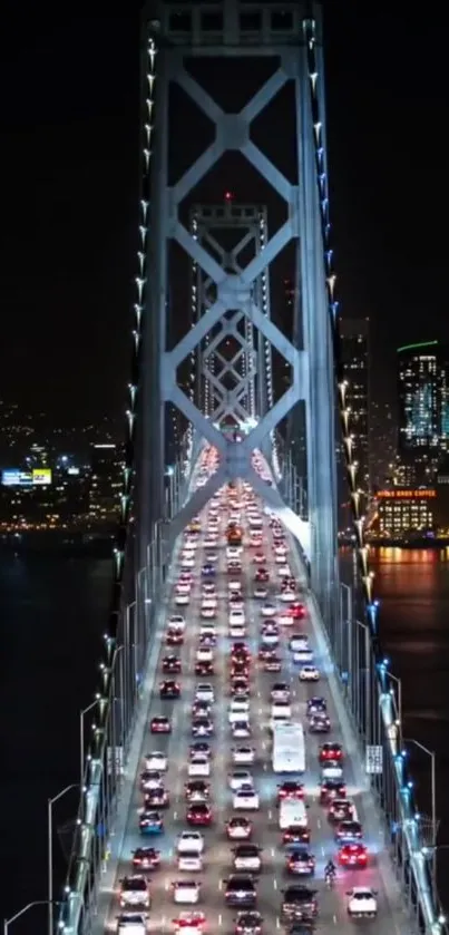 Night view of a lit bridge with city skyline.