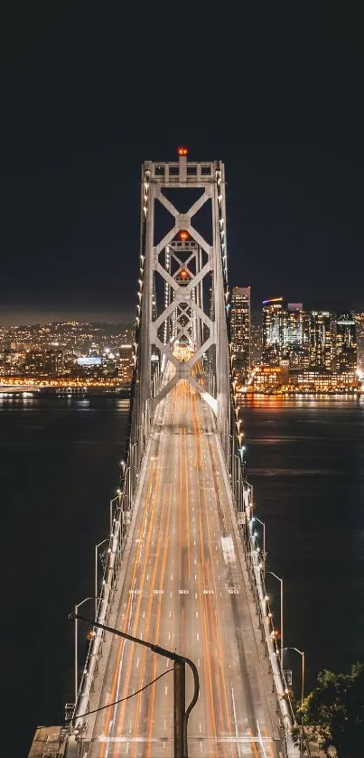 Night view of city bridge with glowing lights and skyline.