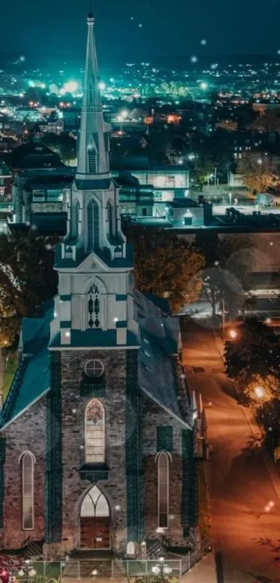 Lit church in cityscape at night with vibrant teal lights.