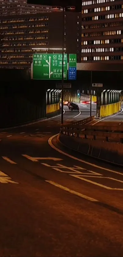 Night city roadscape with urban lights and tall buildings.