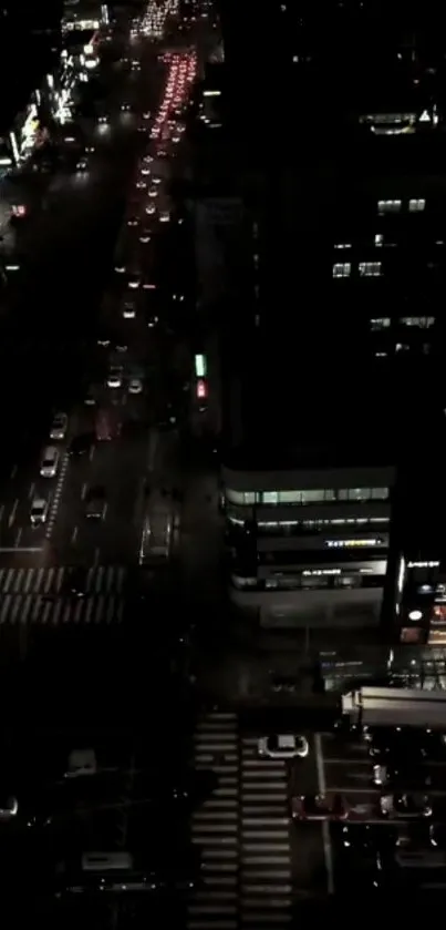 Aerial night view of a bustling city street.