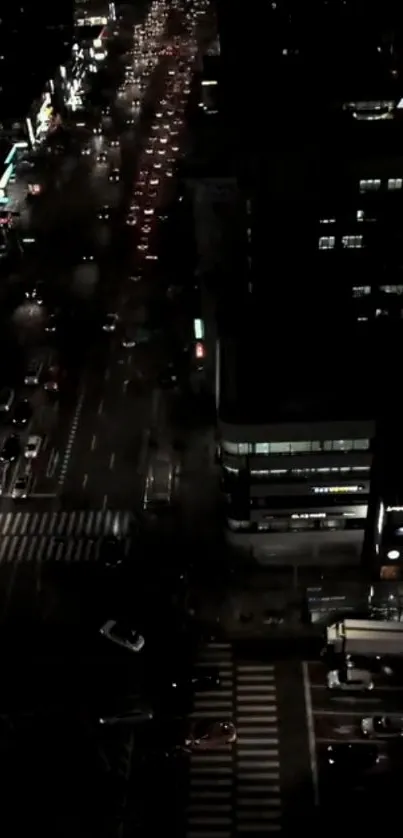 Aerial night view of a bustling city street.