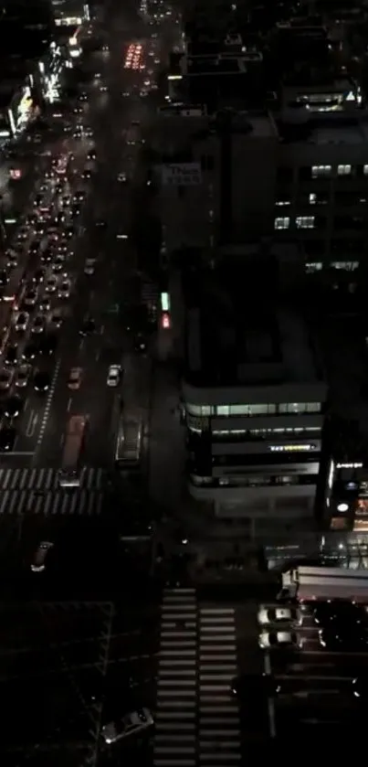 A vibrant city street at night with busy traffic and urban lights.