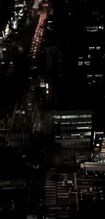 Night view of city streets with neon lights and traffic bustling.