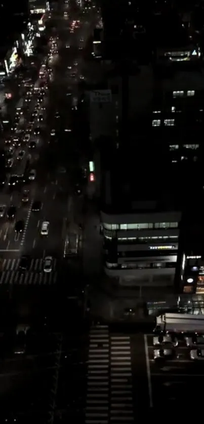 Night city street view with vibrant lights and bustling traffic.