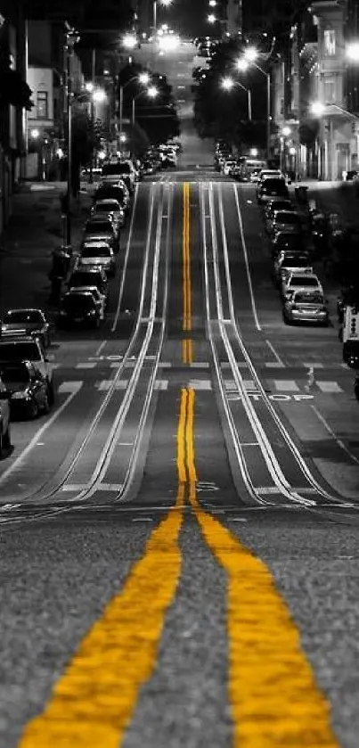 Dramatic city street at night with bold yellow lines.