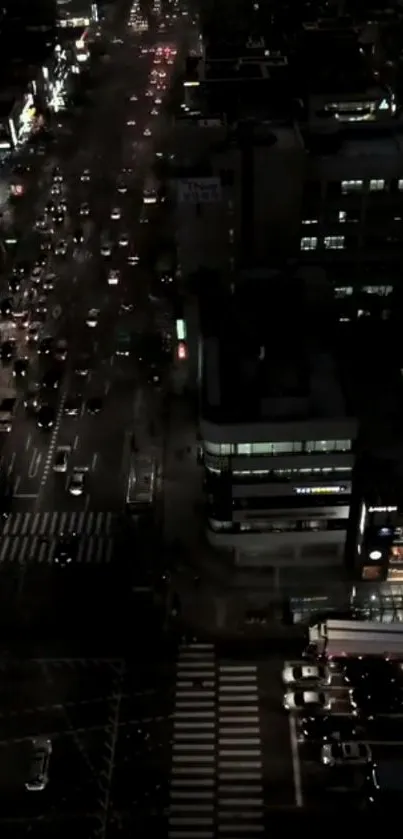 Aerial view of vibrant city traffic at night with street lights.