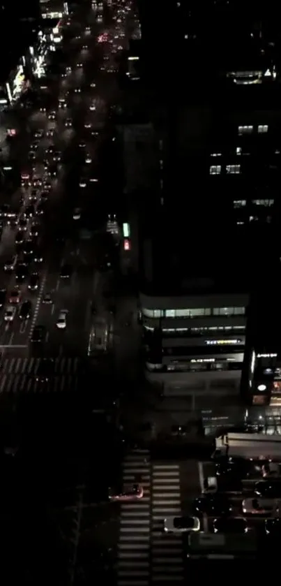 Night city scene with busy traffic and illuminated street lights.