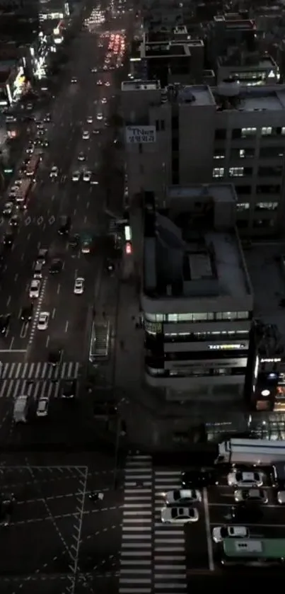 Aerial night view of a vibrant cityscape with brightly lit streets.