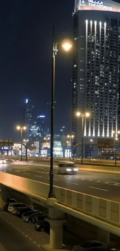 Vibrant cityscape with illuminated boulevard at night.