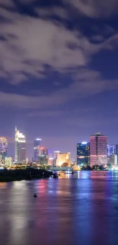 Vibrant night cityscape with skyline and water reflection.