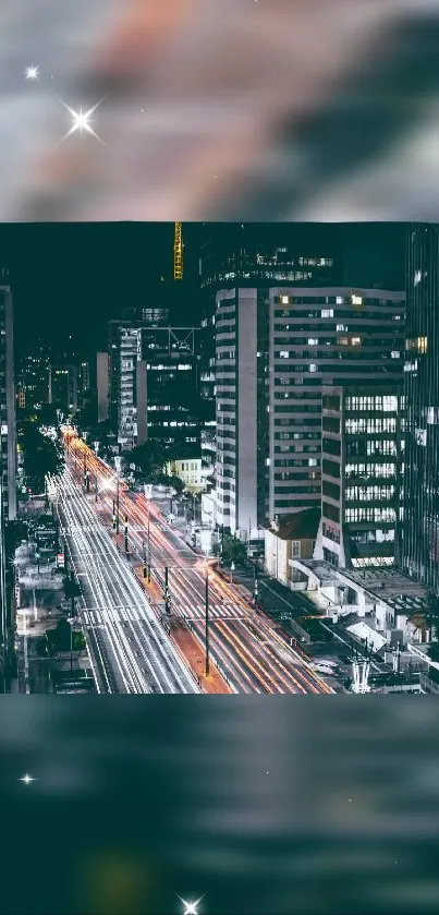 Night cityscape wallpaper with vibrant urban lights and dark sky.