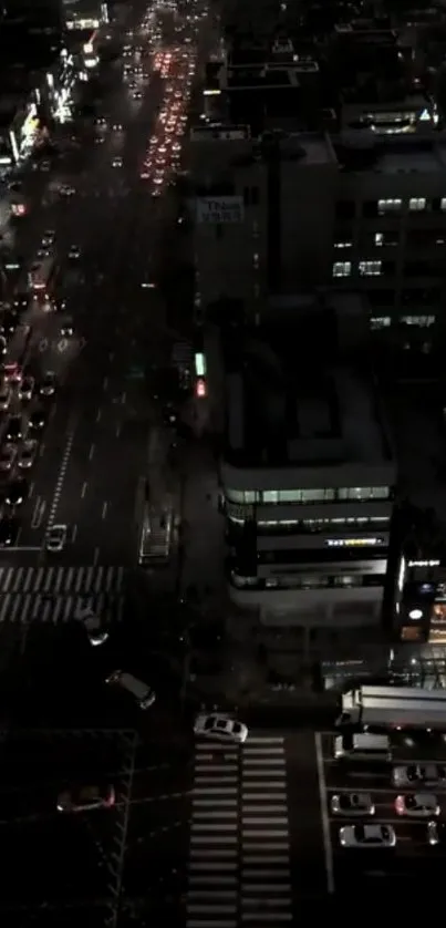 Night cityscape with glowing street lights and busy traffic.