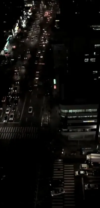 A vibrant aerial view of a city at night with glowing streetlights.