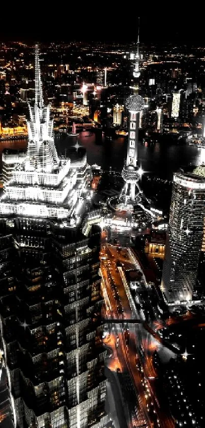 Skyline of a city at night with brightly lit buildings and streets.