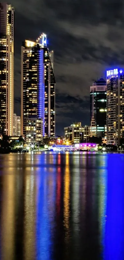 Vibrant night cityscape with skyscrapers and reflections.