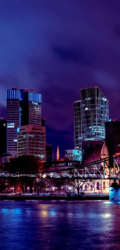 Illuminated modern city skyline at night with vibrant reflections.