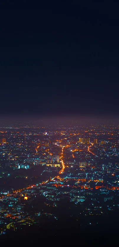 Stunning night cityscape with glowing lights under a deep blue sky.