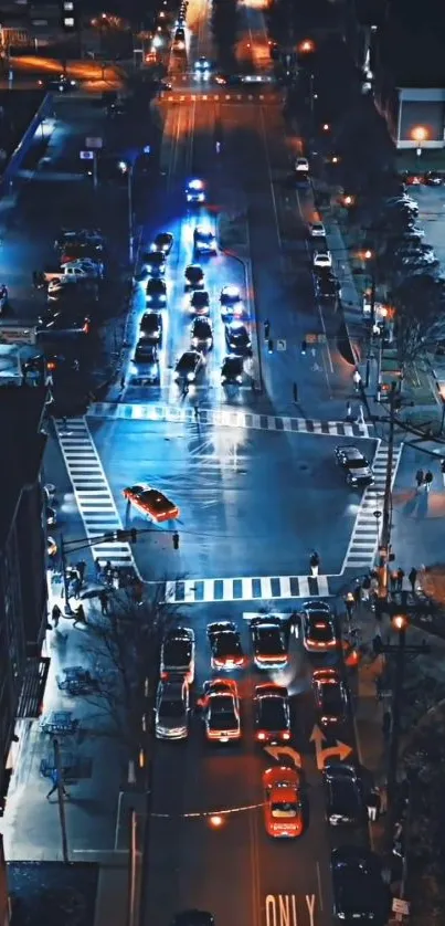 Aerial view of city street with vibrant night lights and traffic.