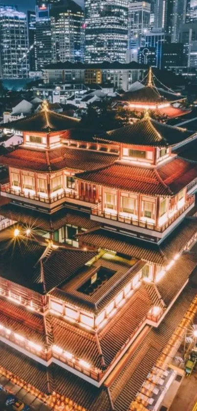 Illuminated temple against city skyline at night.