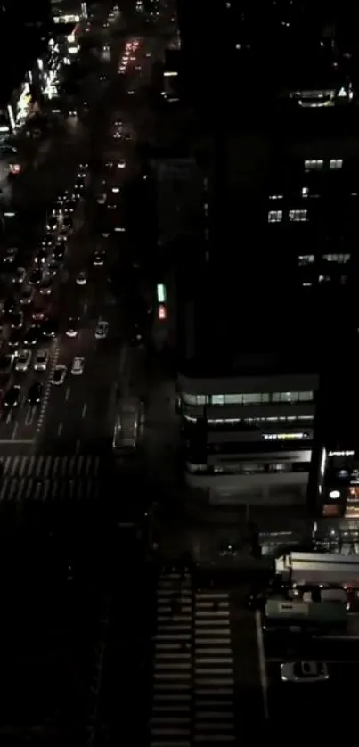 Nighttime cityscape with busy traffic and glowing street lights.