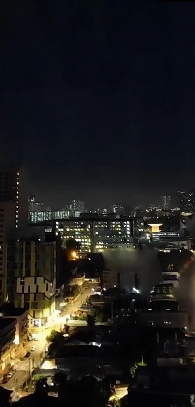 Urban cityscape at night with bright lights and modern buildings.