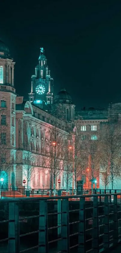 Night cityscape with illuminated clock tower and historic buildings.