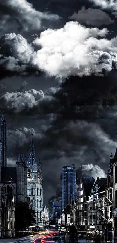 Cityscape at night with dark clouds overhead.