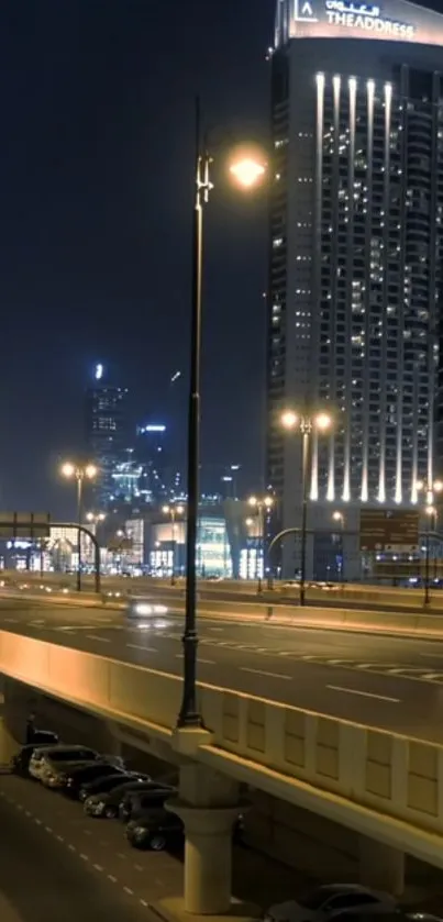 Night cityscape with illuminated skyscrapers and urban streets.