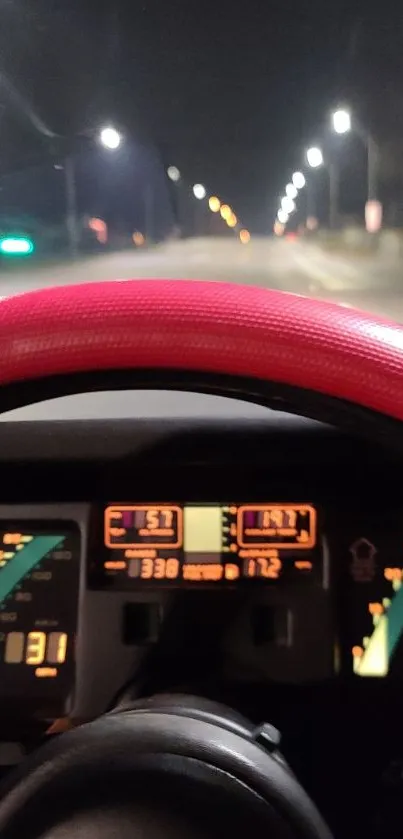 View from car dashboard on a night drive with brightly lit gauges.