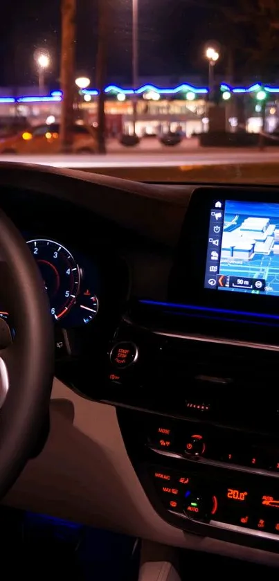 Car dashboard at night with glowing controls and steering wheel.