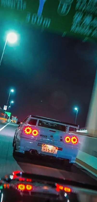 High-speed sports car cruising city highway at night.