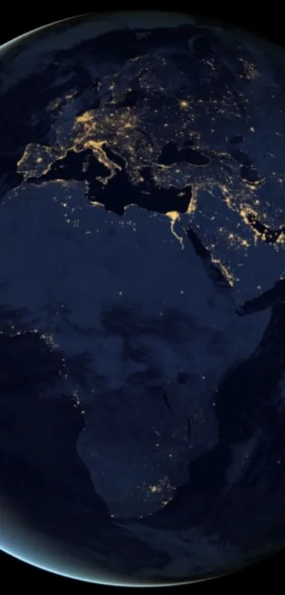 Night view of Earth from space with glowing city lights.