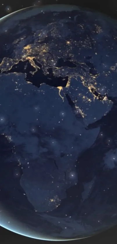 Dark blue night view of Earth from space, aglow with city lights.