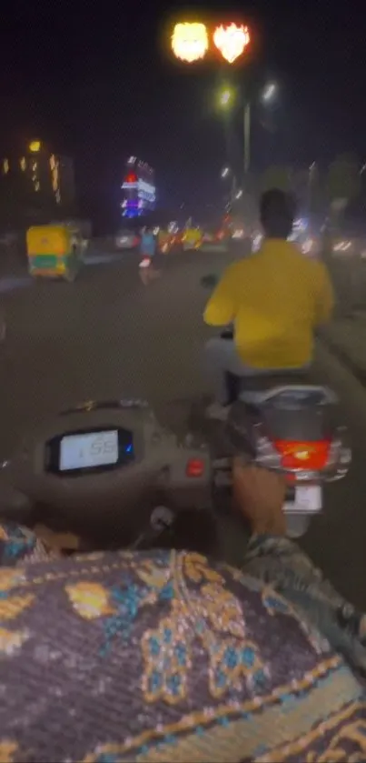 View of a night scooter ride through city streets.