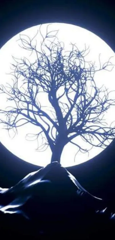 Silhouette of a tree against a bright full moon.