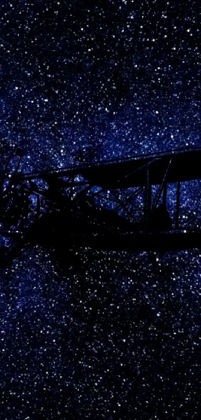 Vintage airplane silhouette against a starry night sky wallpaper.