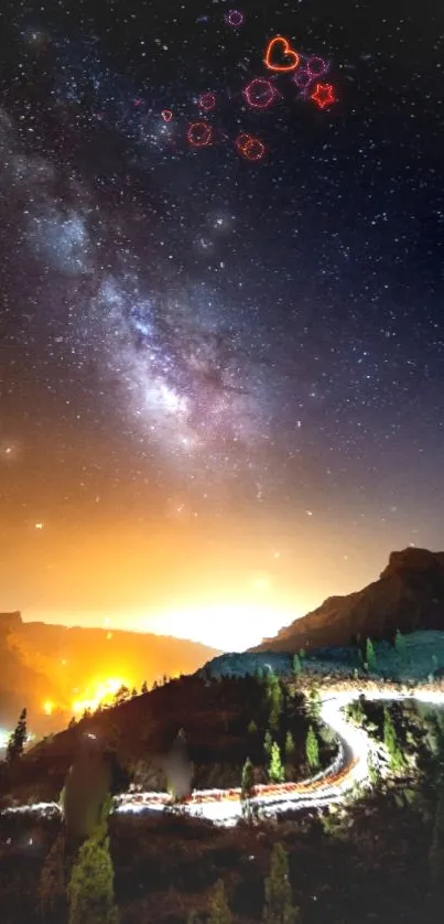 Starry night sky with Milky Way over mountains and winding road.