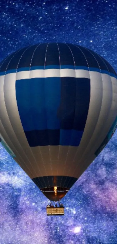 Hot air balloon floating under a starry night sky.