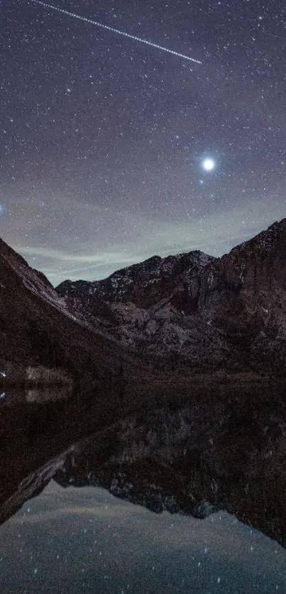 Starry night sky over mountain reflections on a lake.