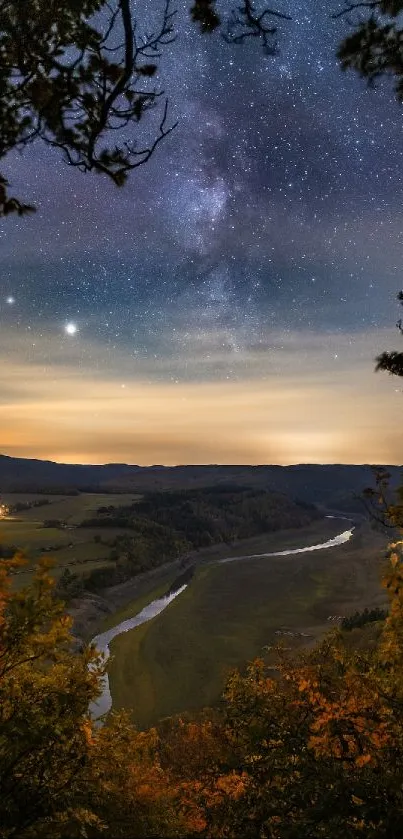 Starry night sky over a serene valley landscape.