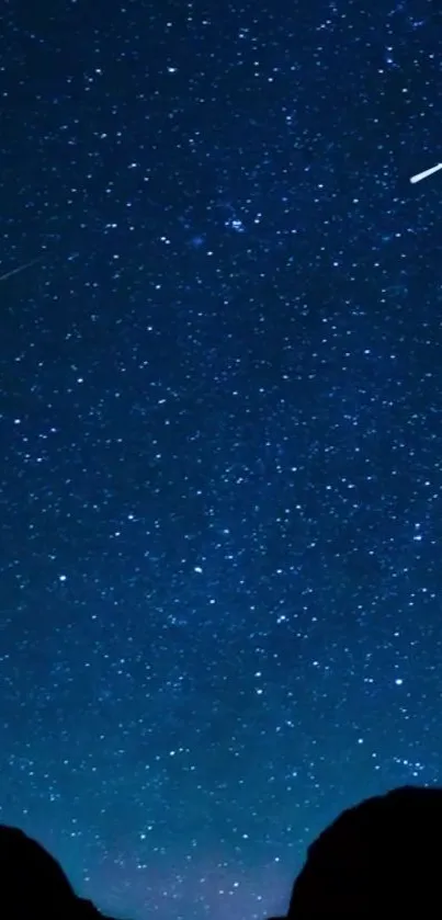 Starry night sky with shooting stars and deep blue hues on mobile wallpaper.