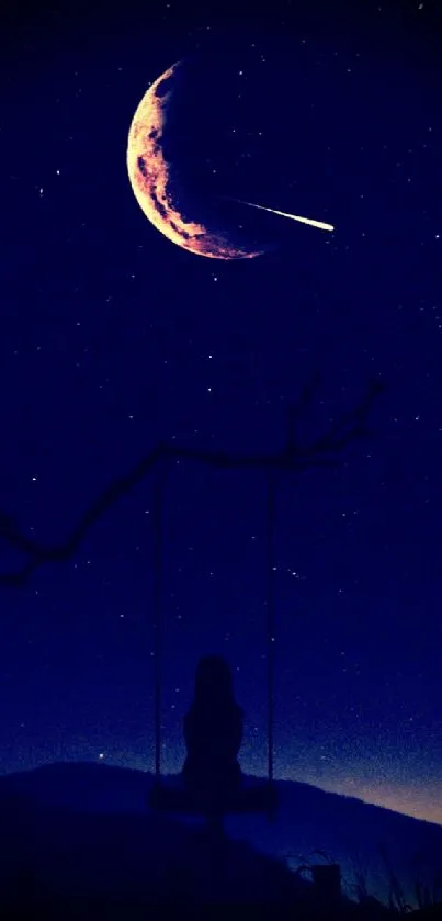 Silhouette on swing under crescent moon and shooting star in a dark blue sky.