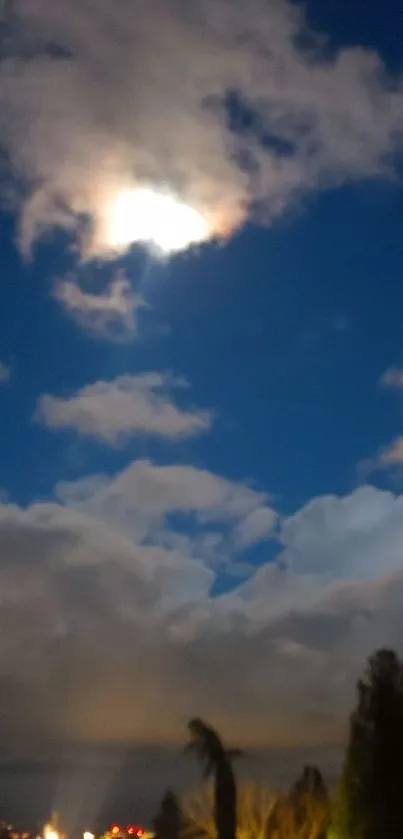 Mobile wallpaper of moonlit night sky with clouds.