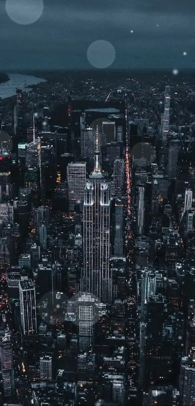 Aerial view of city skyline at night with glowing skyscrapers.