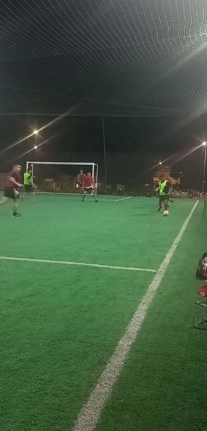 Players enjoying a soccer game on a green field under night lights.